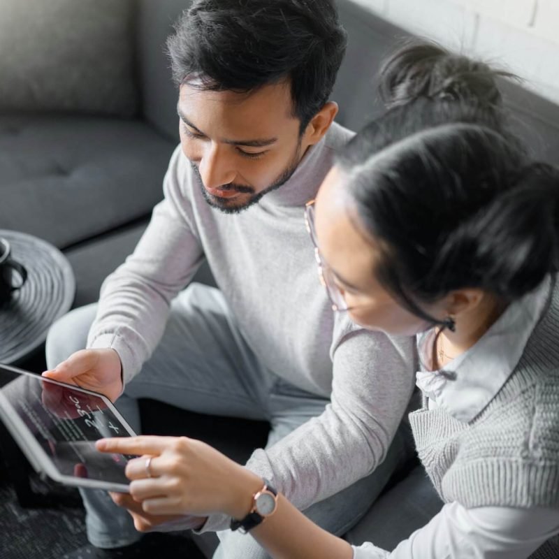 tablet-sofa-and-couple-with-smart-home-technology-for-thermostat-heating-apartment-security-netwo.jpg